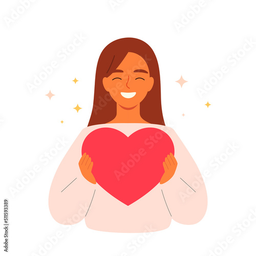 Happy loving woman holding a heart in her hands