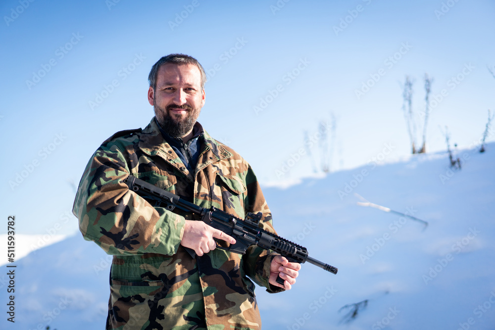 Male Soldier In Military Uniform On Winter Snow. High quality photo
