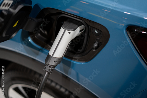 Power supply connect to electric vehicle for charge to the battery. . EV fuel Plug in hybrid car. 