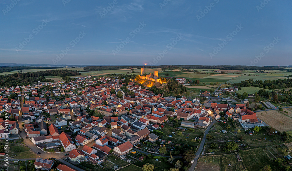 Drone image of Muenzenberg with illuminated castle ruins in Germany