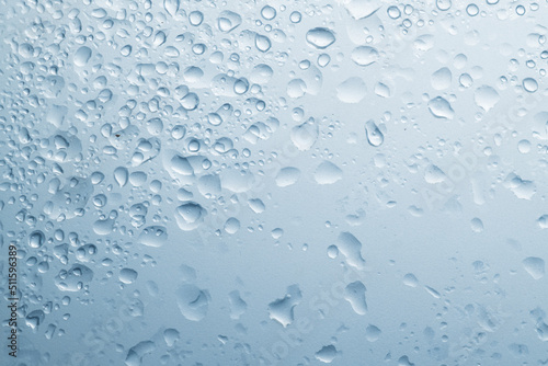 water drops on blue wet matte transparent surface with drops