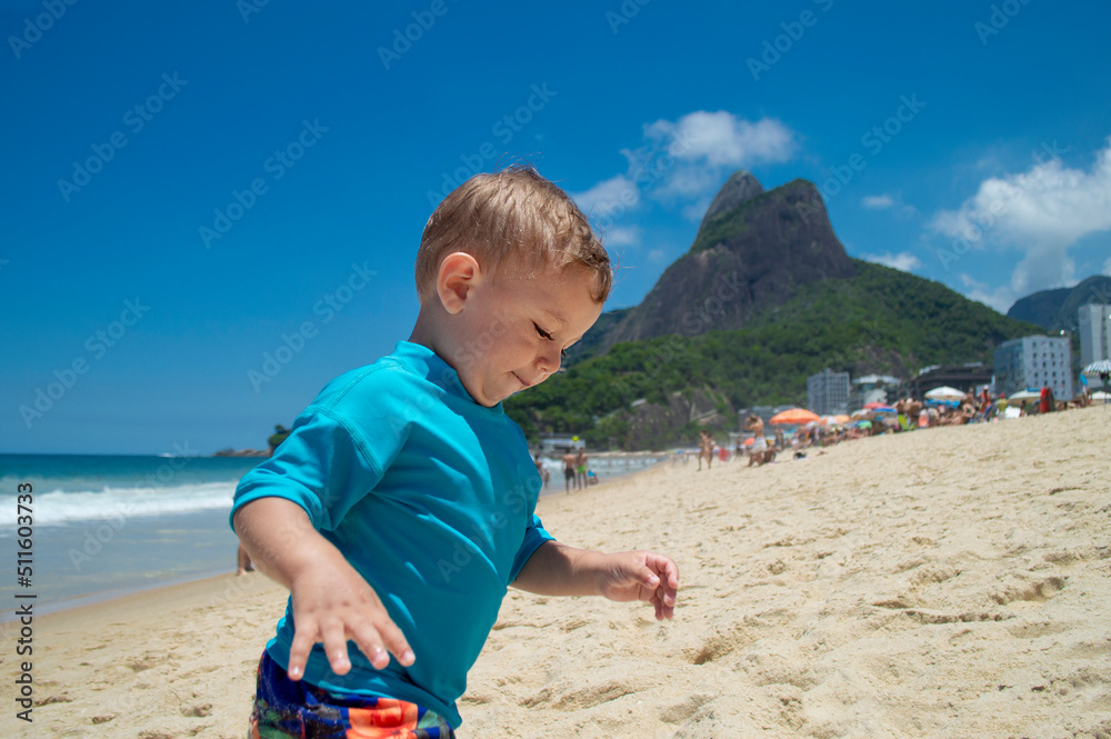 Beautiful little boy on the sand of Copacabana beach, Rio de Janeiro, Brazil Beautiful little boy on the sand of Copacabana beach, Rio de Janeiro, Brazil
