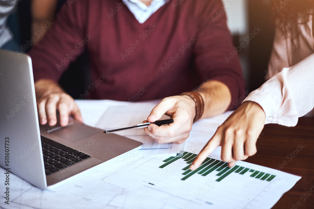 Technology simplified the way we do business. Shot of unrecognizable businesspeople looking at business charts. Technology simplified the way we do business. Shot of unrecognizable businesspeople looking at business charts.