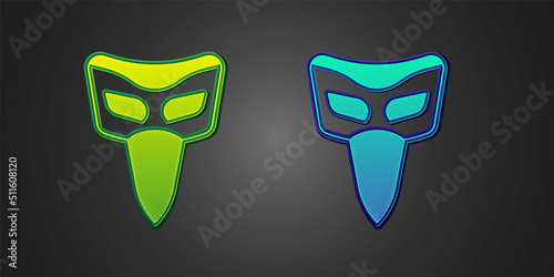 Green and blue Carnival mask icon isolated on black background. Masquerade party mask. Vector