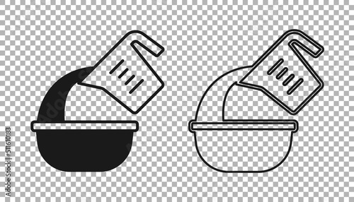 Black Measuring cup pouring liquid into bowl icon isolated on transparent background. Plastic graduated beaker with handle. Vector