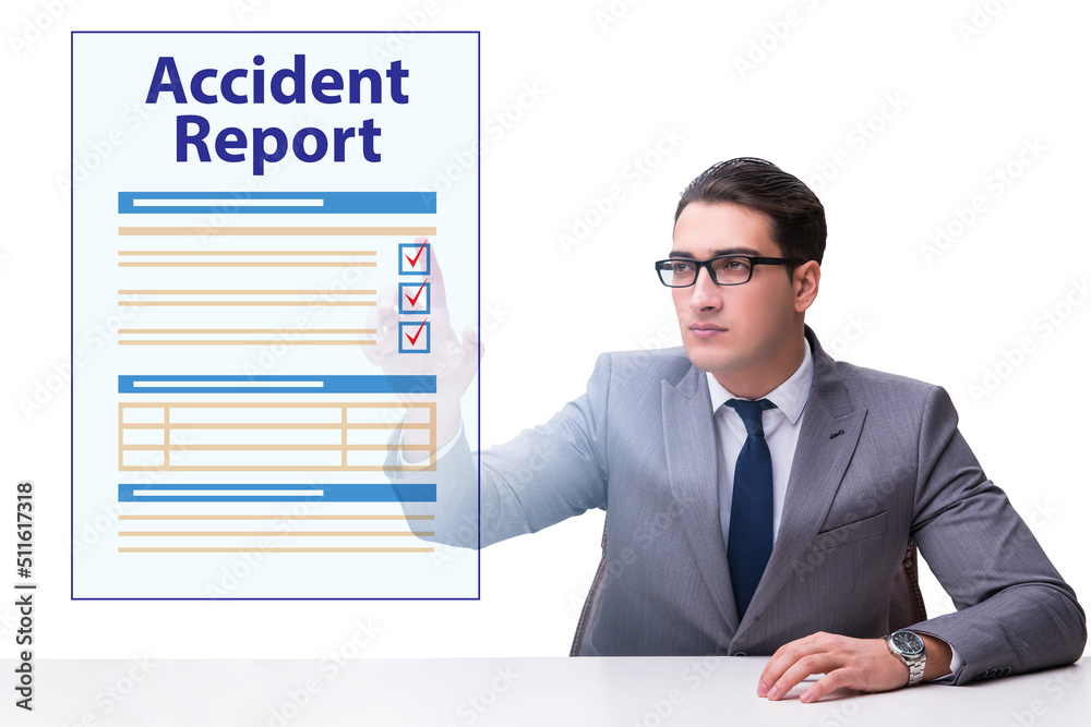 Businessman pressing buttons on virtual accident report Businessman pressing buttons on virtual accident report