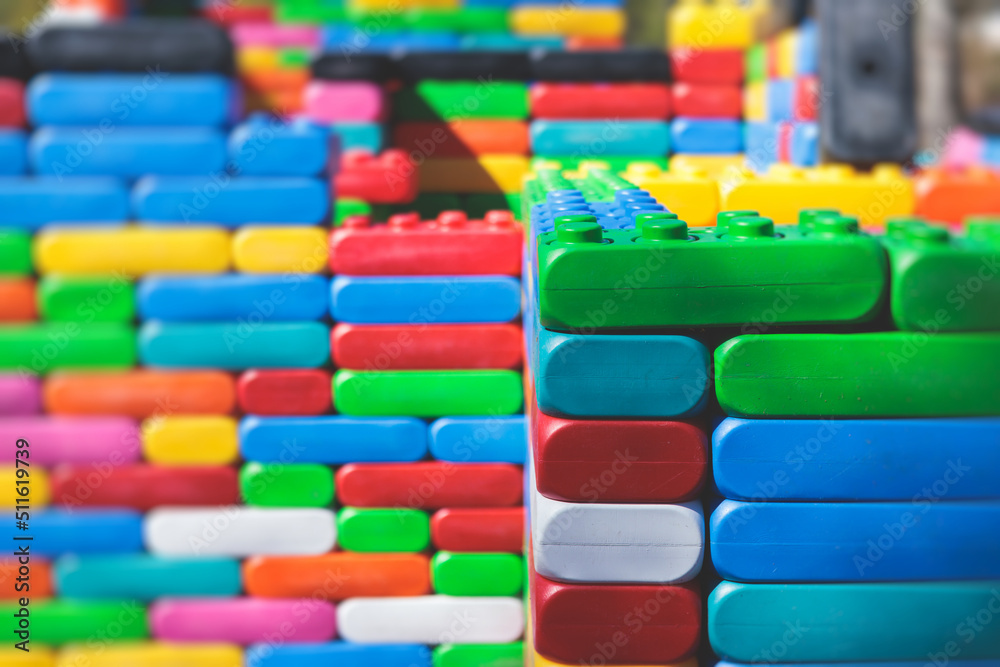 Children play colorful big toy blocks in kindergarten day care center playground, kids playing with various plastic mega construction blocks bricks Children play colorful big toy blocks in kindergarten day care center playground, kids playing with various plastic mega construction blocks bricks