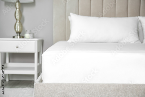 Tablou pe pânză Mattress with white fitted sheet and pillows indoors