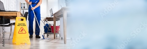 Janitor Cleaning Floor In Office photo