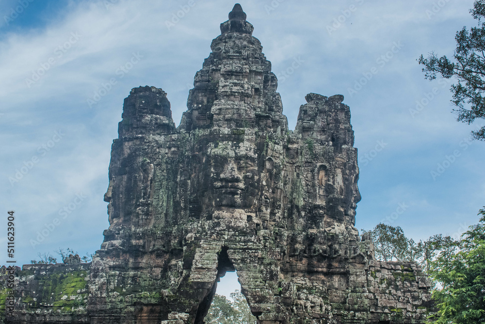 A sandstone carving of a smiling face on the entrance arch of Angkor Thom, Cambodia. A sandstone carving of a smiling face on the entrance arch of Angkor Thom, Cambodia.