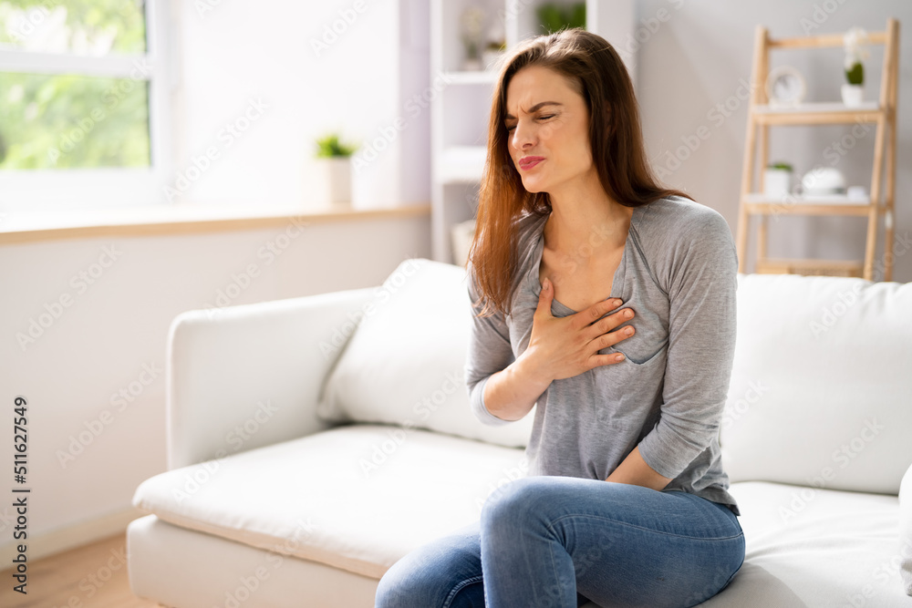 Woman Suffering From Chest Pain Woman Suffering From Chest Pain