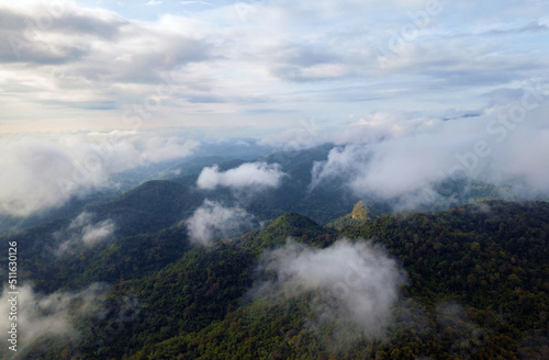 Aerial view Beautiful panorama of morning scenery Golden light sunrise And the mist flows on high mountains forest. Pang Puai, Mae Moh, Lampang, Thailand. 