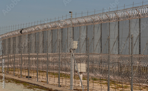 Vászonkép forbidding high security fence securing prisoners inside the confinement facility-in this Victorian prison