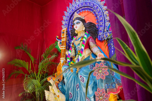Idol of Goddess Saraswati at Kolkata, West Bengal, India. Saraswati is Hindu goddess of knowledge, music, art, wisdom, and learning. Worshipping is done to get divine blessing to achieve excellence.