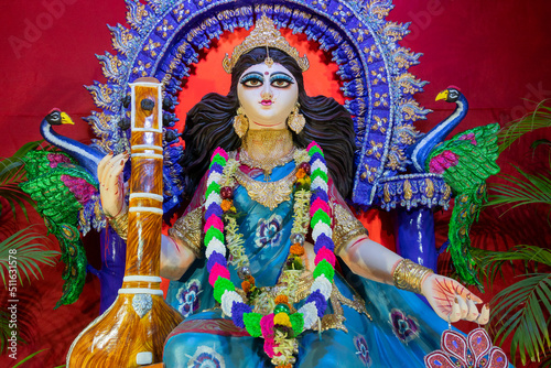 Idol of Goddess Saraswati with veena, a musical instrument, at Kolkata, West Bengal, India. Saraswati is Hindu goddess of knowledge, music, art, wisdom, and learning.