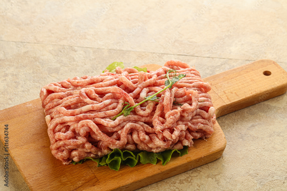 Raw minced pork meat over board Raw minced pork meat over board