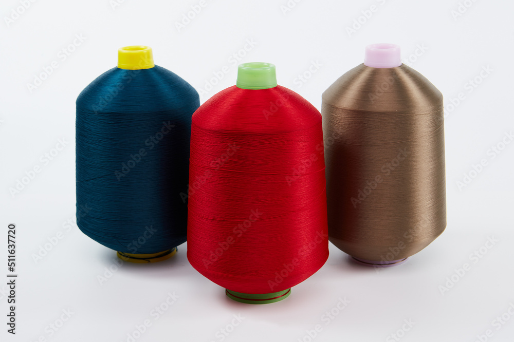 Multi color of yarn bobbins, spool sewing on the white background. Multi color of yarn bobbins, spool sewing on the white background.