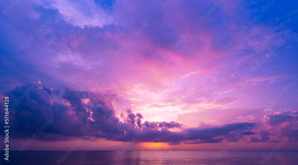 Landscape Long exposure of majestic clouds in the sky sunset or sunrise over sea with reflection in the tropical sea Beautiful landscape scenery Amazing colorful light of nature Landscape