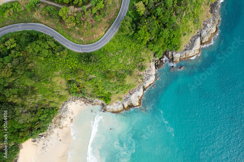 Fototapeta Naklejka Na Ścianę i Meble -  Aerial view of curve road along the seashore at Phuket Thailand beautiful seacoast and open sea in summer season Nature recovered Environment and Travel background