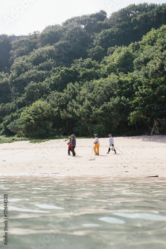 Fisherman walking on the beach of Bali