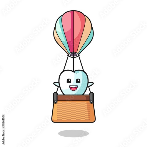 tooth mascot riding a hot air balloon