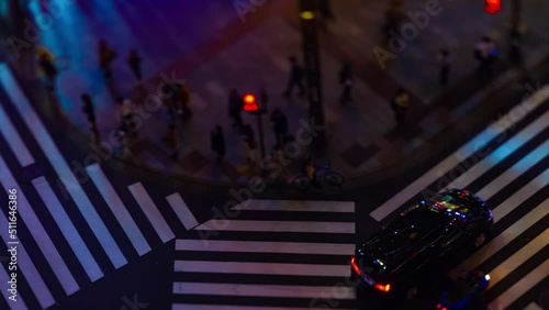 A night timelapse of the miniature traffic jam at the crossing in Ginza tiltshift photo