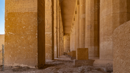 Slika na platnu A narrow passage between two rows of columns leads forward