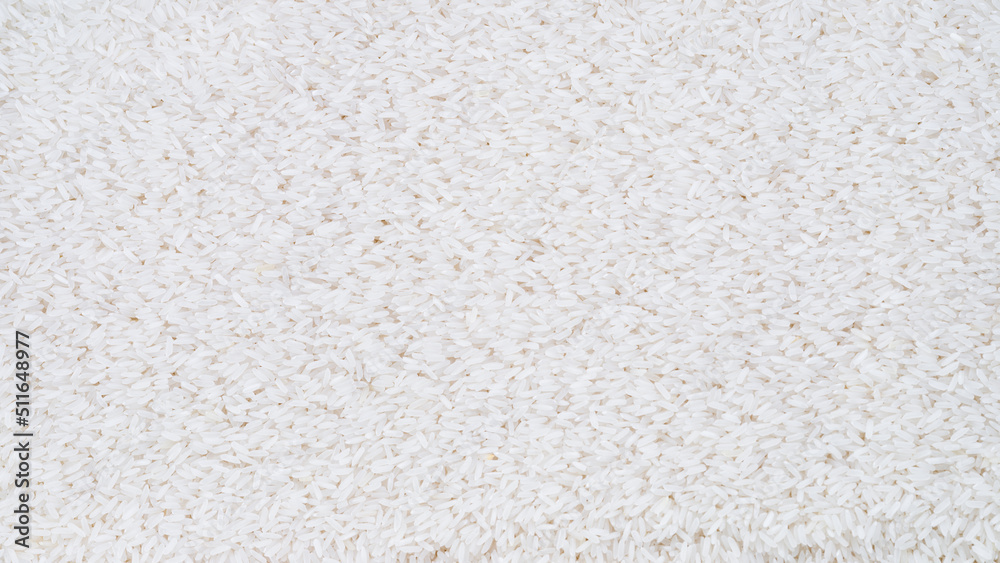 White rice detail texture. Panoromic close-up shot of the rice background White rice detail texture. Panoromic close-up shot of the rice background