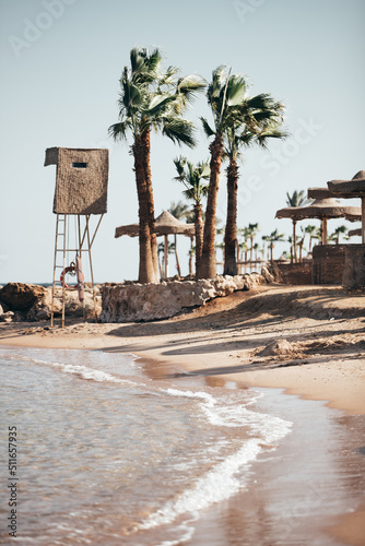 coastal african beach resort in hurghada egypt with palm trees and lifeguard tower 