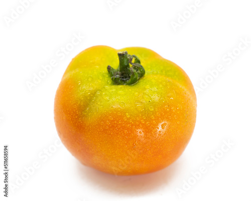 single half ripe tomato on white background.