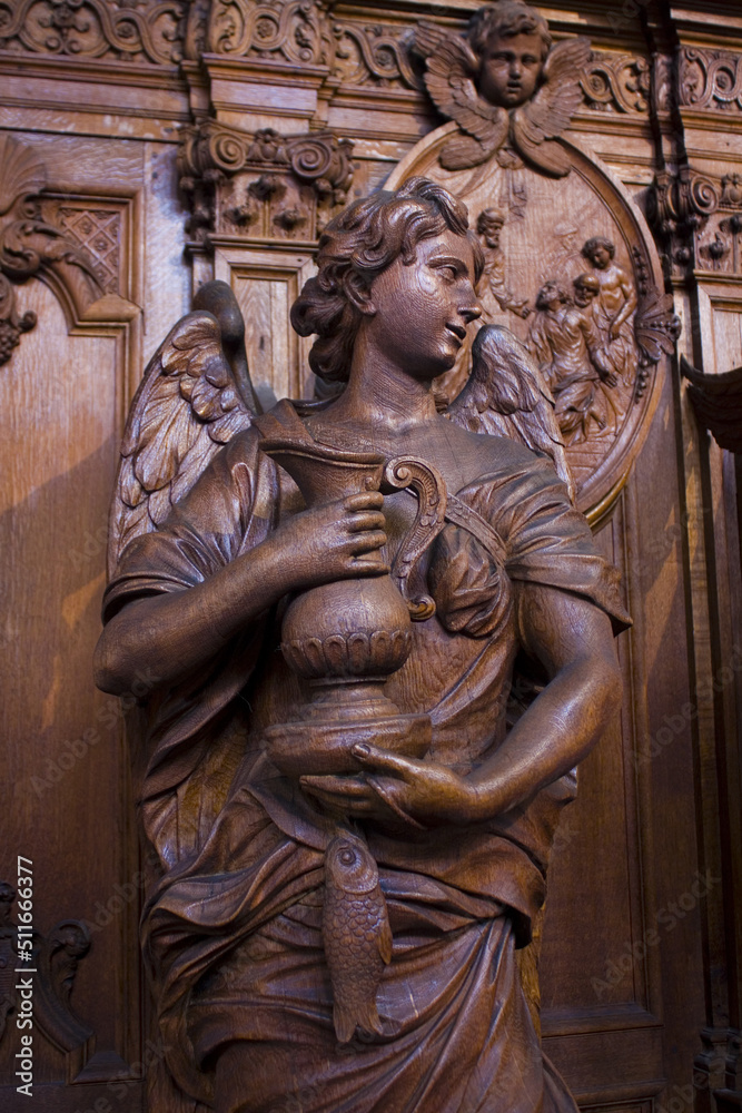 Rich wooden sculptural decoration in the interior of St. Charles Borromeo Church in Antwerp, Belgium