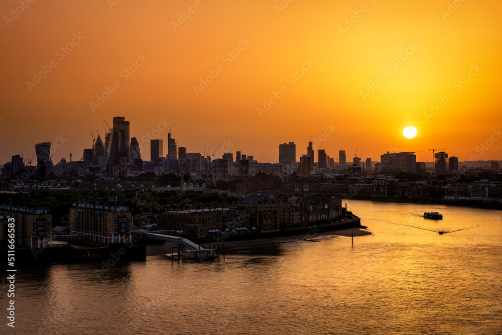 Panorama of the London skyline with river Thames during a fiery summer sunset, England