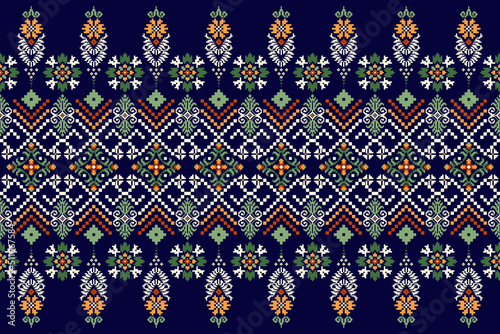 Beautiful floral knitted embroidery.geometric ethnic oriental pattern traditional on blue background.Aztec style,abstract,vector,illustration.design for texture,fabric,clothing,wrapping,carpet,print. photo