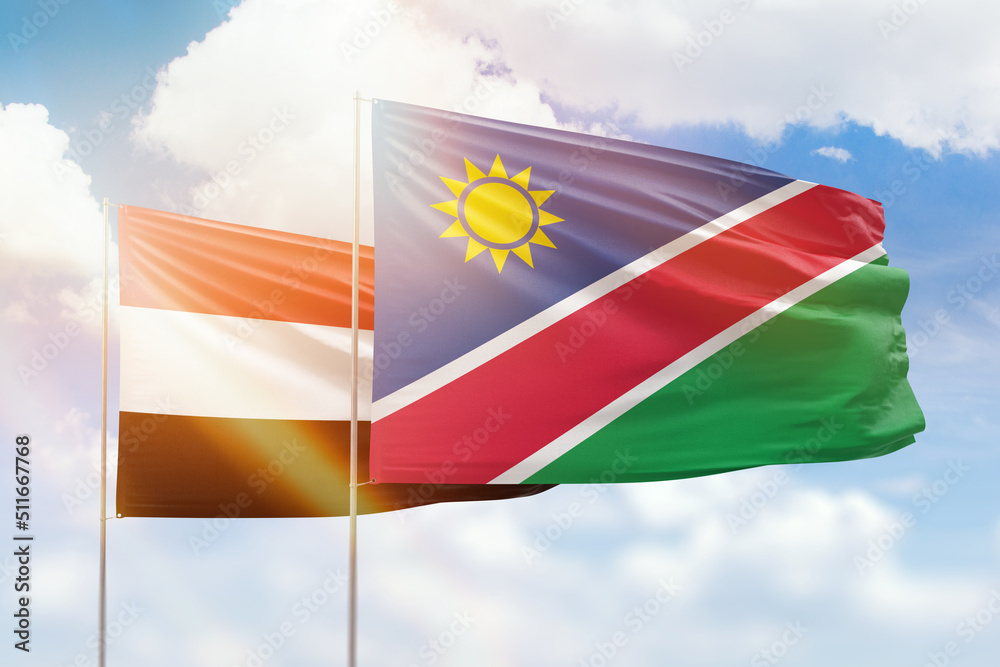 Sunny blue sky and flags of namibia and yemen Sunny blue sky and flags of namibia and yemen