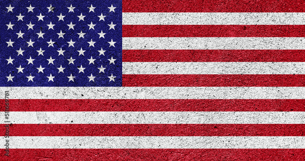 Fototapeta premium US national flag on a plastered wall