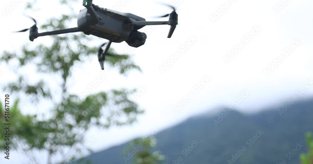 Flying drone taking off on hand in summer forest Flying drone taking off on hand in summer forest