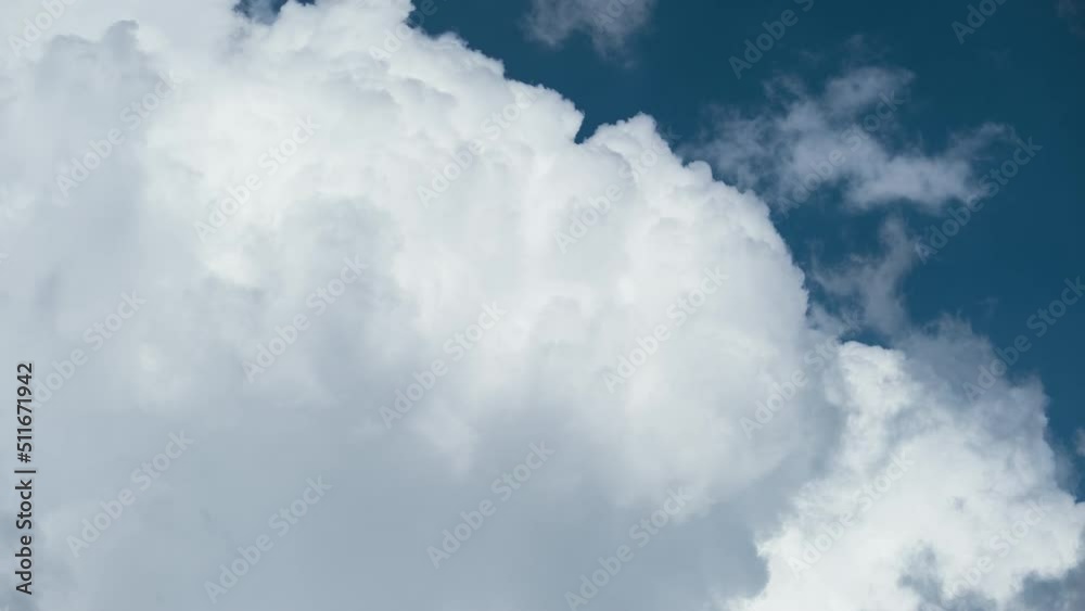 Timelapse of white puffy cumulus clouds forming on summer blue sky. Moving and changing cloudscape weather Timelapse of white puffy cumulus clouds forming on summer blue sky. Moving and changing cloudscape weather