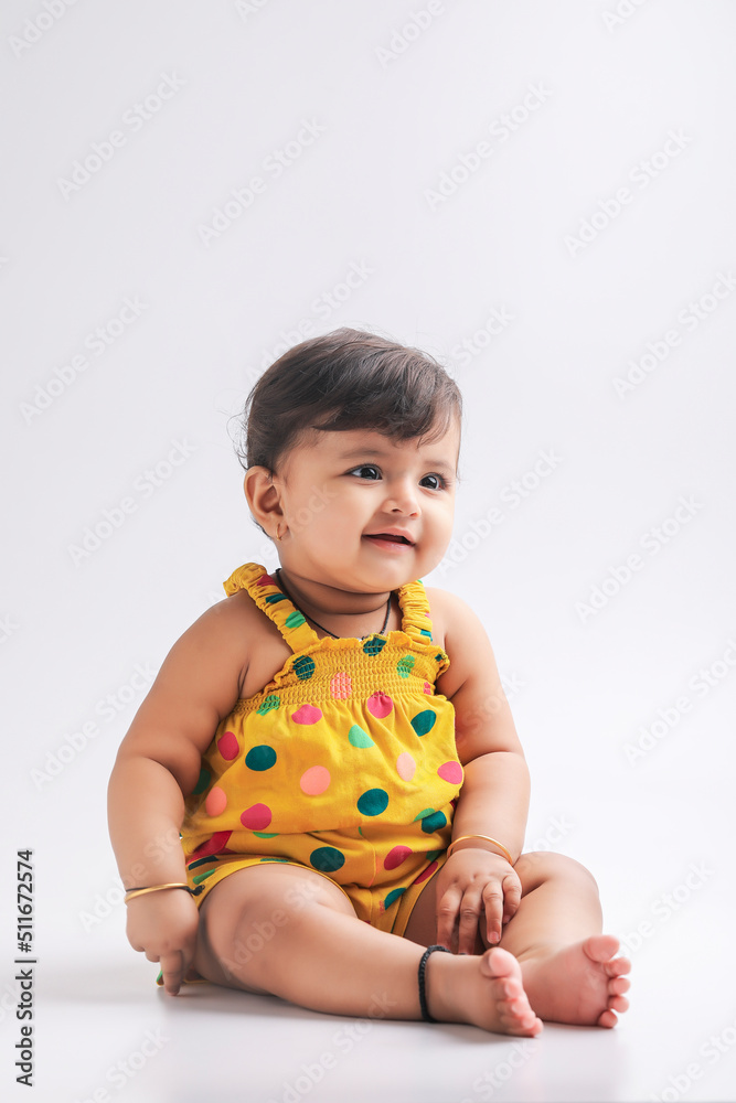 Cute indian baby girl smiling and giving expression. Cute indian baby girl smiling and giving expression.