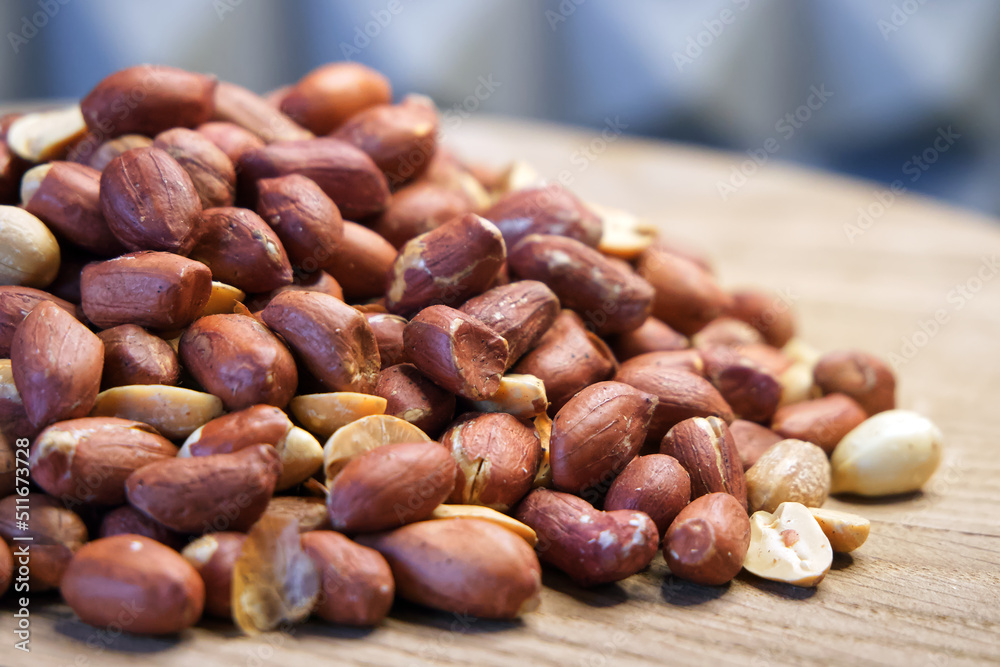 Heap of roasted peanuts, side view. Peanuts macro. Spanish Peanuts in pile Heap of roasted peanuts, side view. Peanuts macro. Spanish Peanuts in pile