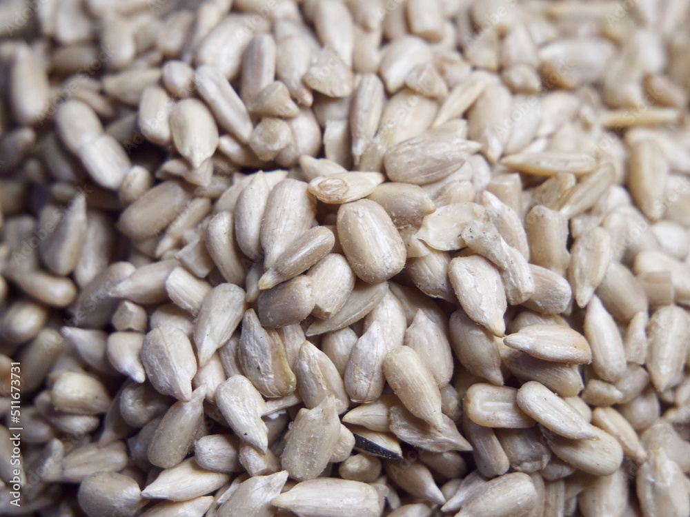 Lots of peeled sunflower seeds close-up. Heap of sunflower seeds, full frame. Lots of peeled sunflower seeds close-up. Heap of sunflower seeds, full frame.