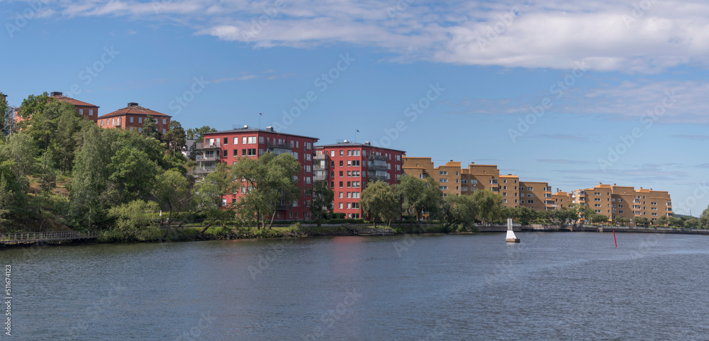 Water front color full apartment houses at the pier Ekensberg a sunny summer day in Stockholm