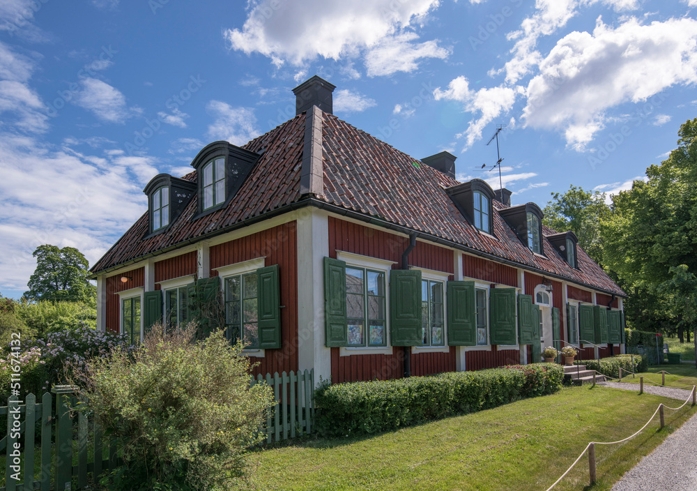 Apartment houses, built for craftsman in the 1700s in the district Kantoon on the Drottningholm island a sunny summer day in Stockholm