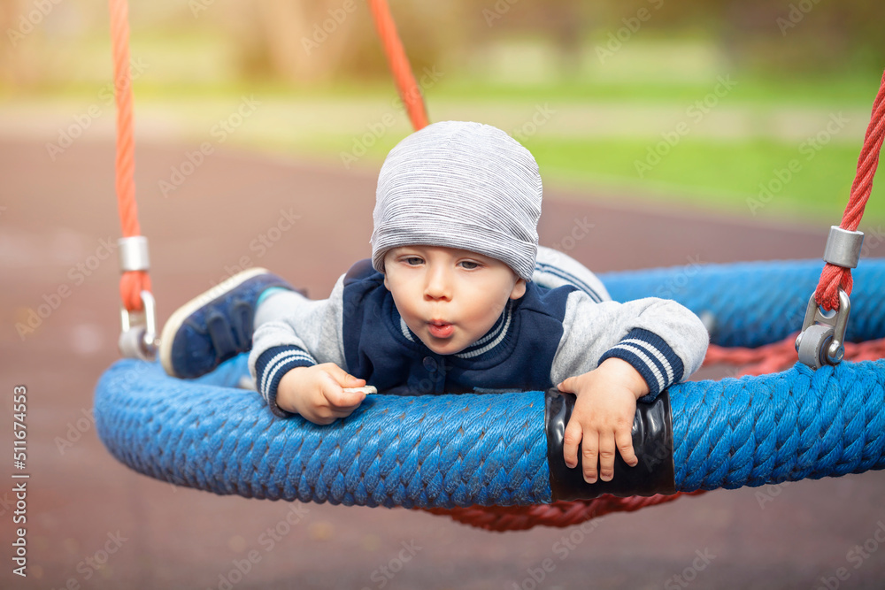 Сhild on the playground. Kids play outdoor. Сhild on the playground. Kids play outdoor.
