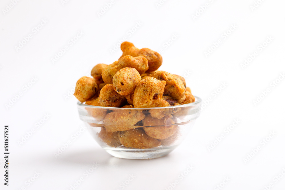 Roasted coated peanuts on white background. Delicious snack peanut.