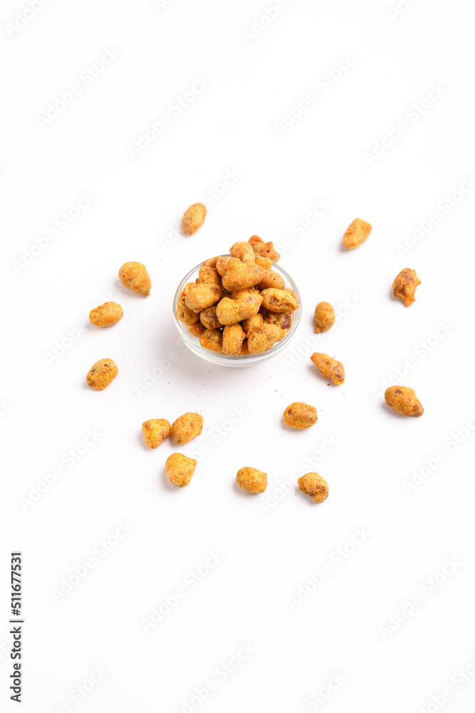 Fried coated peanuts on white background. Delicious snack peanut. Fried coated peanuts on white background. Delicious snack peanut.