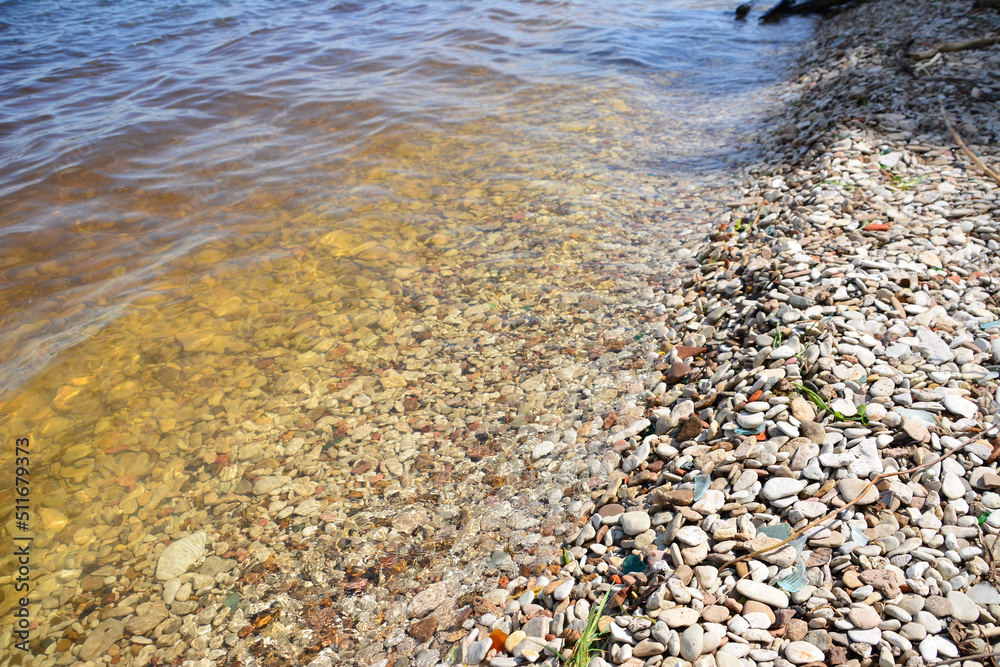 clear lake water with pebble beach, close-up clear lake water with pebble beach, close-up