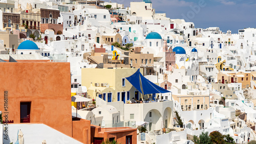 The houses of iconic Oia on Santorini island huddled on the town's steep terraces