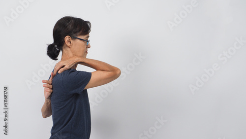 Asian senior or older woman had touch a back posture on white background. Side view photo