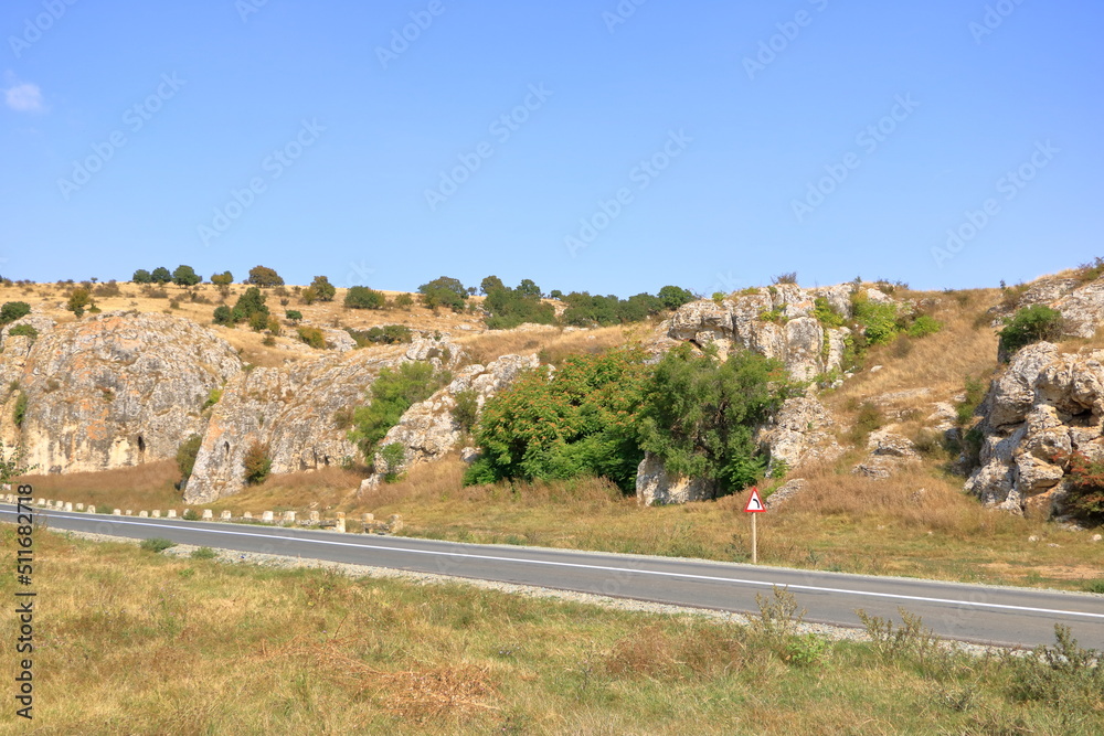 mountain landscape with some of the oldest limestone rock formations in Europe, in Dobrogea Gorges (Cheile Dobrogei), Romania mountain landscape with some of the oldest limestone rock formations in Europe, in Dobrogea Gorges (Cheile Dobrogei), Romania