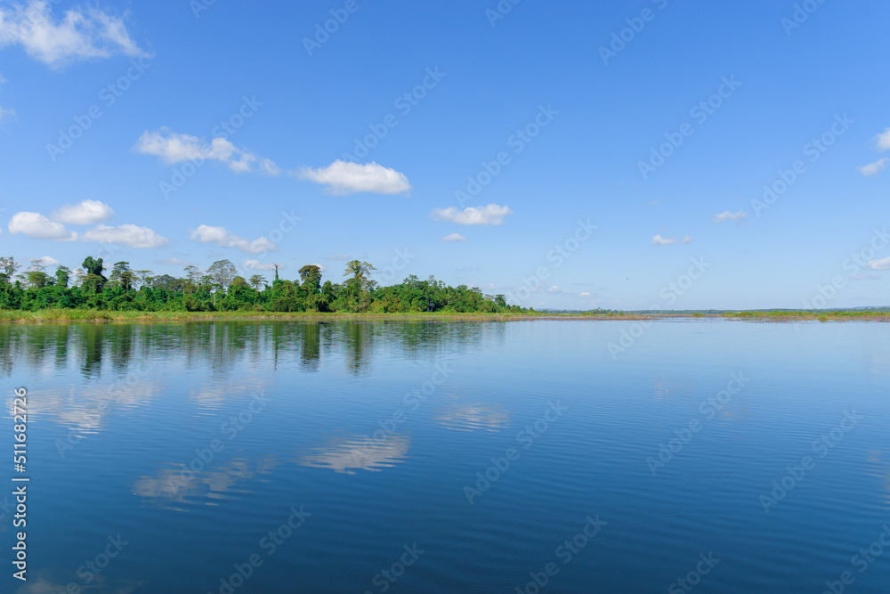 Large island in the lake. There is a beautiful cloud reflecting on the water At  Bueng Kan Province of Thailand 5